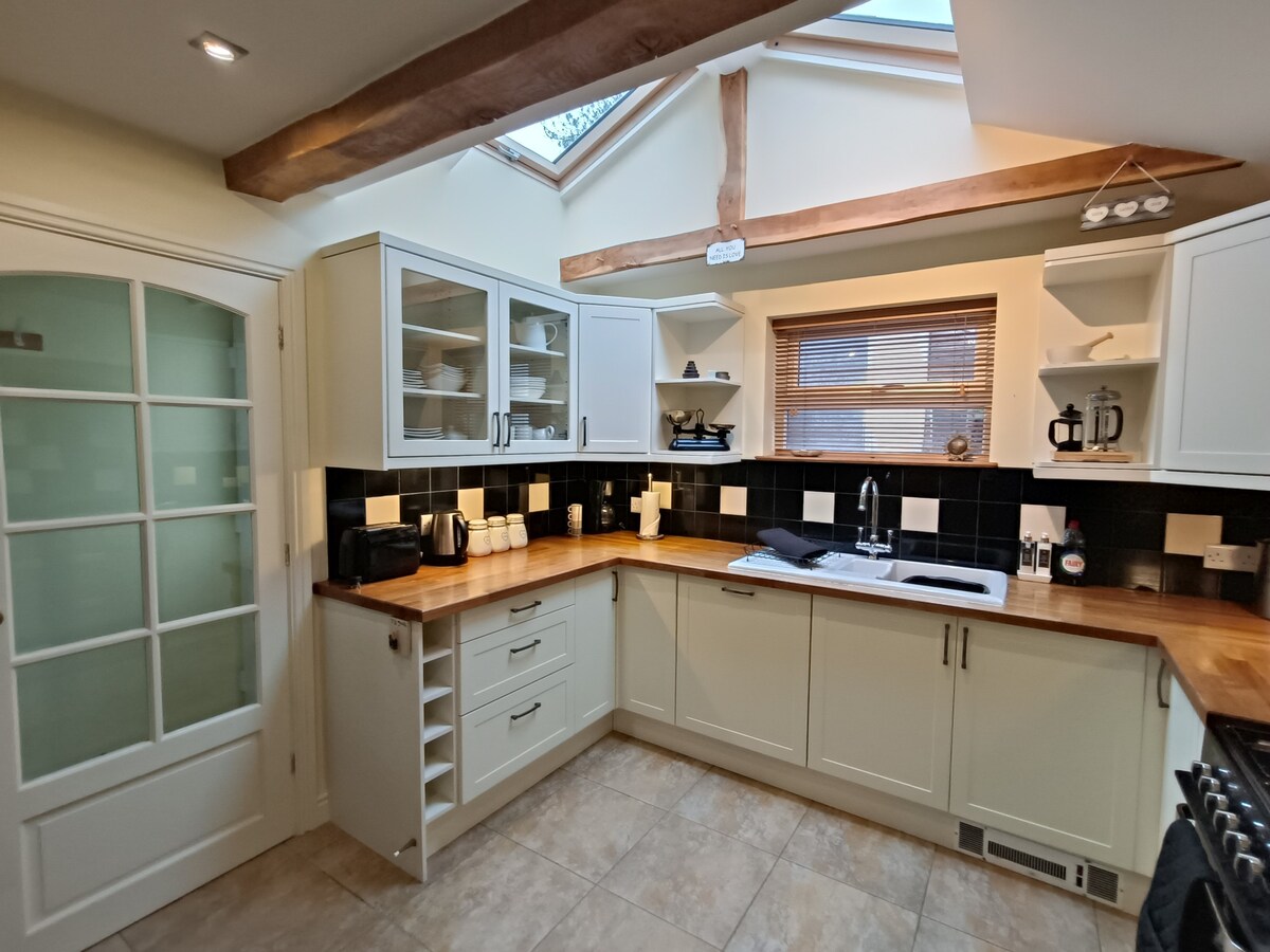 The kitchen with roof lights for a bright airy room