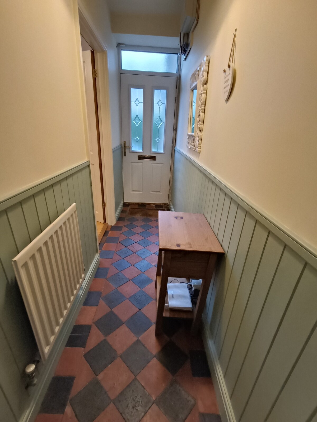 Entrance hall with original tile floor