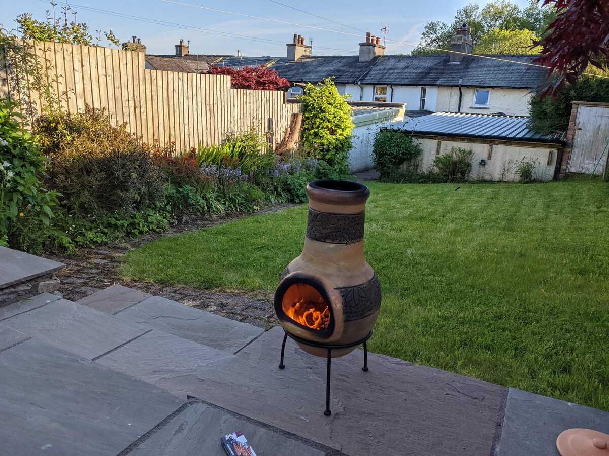 Burning chimenea on the patio in the rear garden