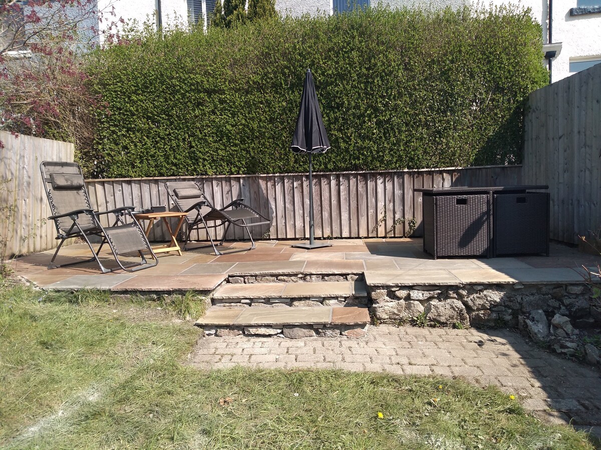 Rear garden and patio with table and chairs ready for your BBQ