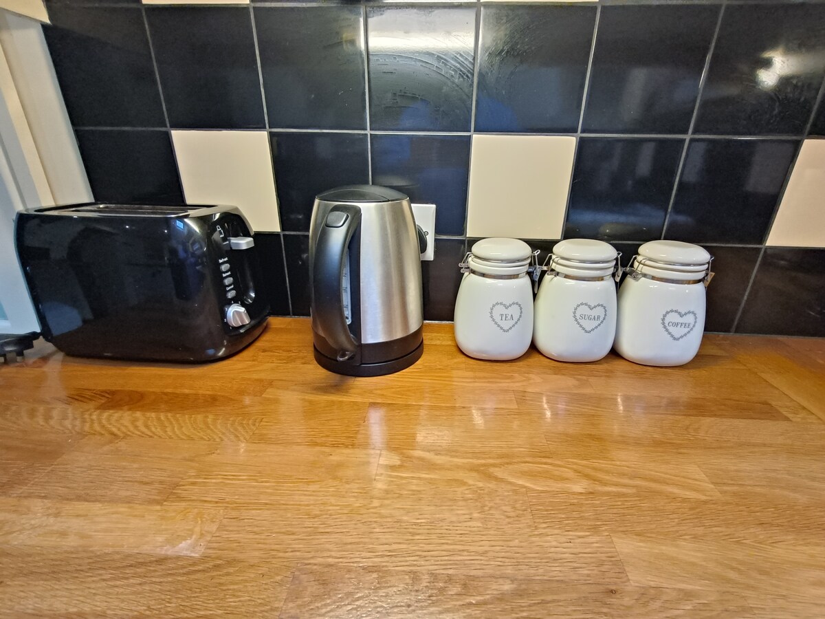 Kitchen showing kettle and toaster